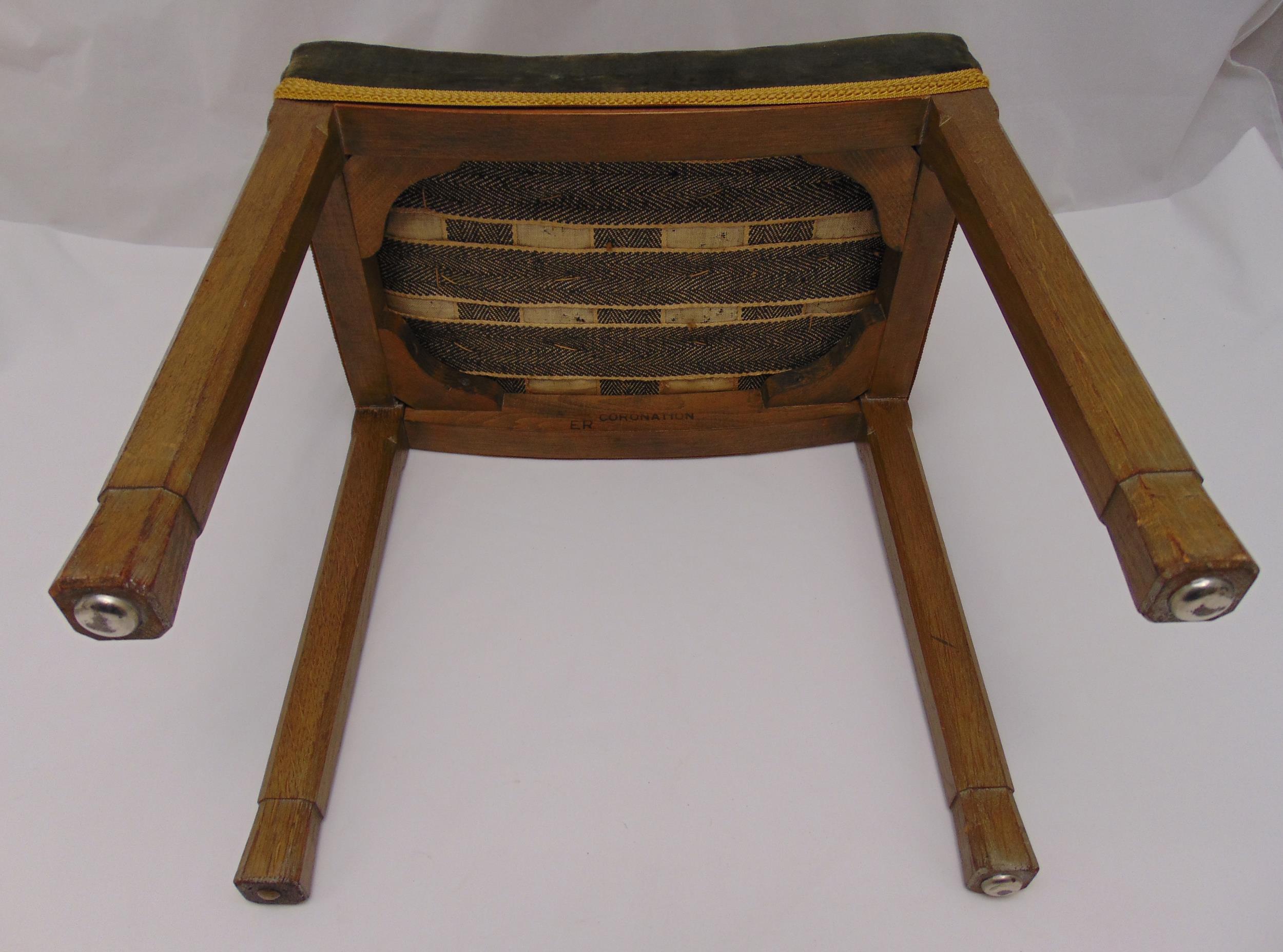 A Queen Elizabeth II Coronation stool, upholstered on four tapering rectangular oak legs, stamped to - Image 2 of 3