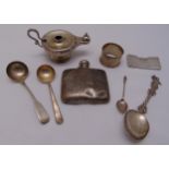 A quantity of hallmarked silver and white metal to include a hip flask, an oil lamp, a napkin ring