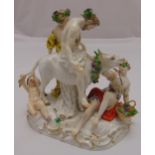 Meissen figural group of The Drunken Silenus supported by Bacchus slumped on a donkey with a