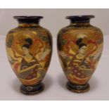 A pair of Japanese Satsuma vases, inverted pear shape, the sides decorated with female figures, 21.