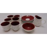 A Susie Cooper 1960s polka dot pattern coffee set to include cups, saucers, a sugar bowl and a cream