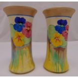A pair of Clarice Cliff Bizarre vases of waisted cylindrical form decorated to the sides with