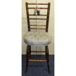 A Victorian oak childs chair on turned legs with simulated bamboo back and upholstered seat, 93cm (
