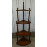 A Victorian mahogany corner four tier whatnot with turned wooden supports, 140 x 59 x 38cm