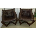 A pair of late 20th century leatherette chairs on W frame bases