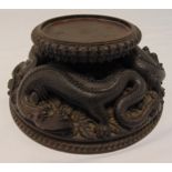 Chinese carved wooden hardwood stand of circular form carved with dragons, 11 x 26cm