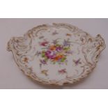 A Dresden cake plate of shaped oval form decorated with floral sprays and gilded leaf and scroll