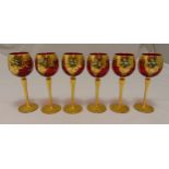 A set of six Venetian red hock glasses with gilded decoration on circular spreading bases