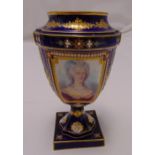 A Sevres blue ground baluster vase decorated with a hand painted portrait of a lady on a raised