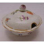 A Meissen dish and cover decorated with flowers and leaves, marks to the base A/F, 15.5cm (d)