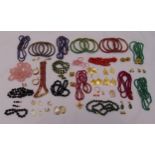 A quantity of costume jewellery to include necklaces, bangles, bracelets and earrings