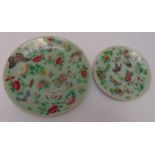 A late 19th century Chinese Famille Rose plate decorated with butterflies, flowers and leaves and