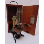 A Voigtlander Braunschweig early 20th century microscope in fitted wooden case