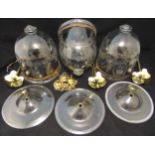 A set of three glass bell jar lampshades etched with flowers and leaves by Val St Lambart to include