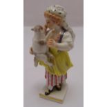 A Meissen figurine of a girl carrying a lamb on raised square base, marks to the base, 10.5cm (h)