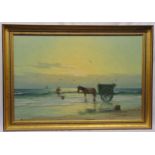 A framed oil on canvas of a boy with a donkey and cart on the seashore, indistinctly signed bottom