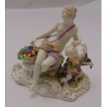 A Meissen 19th century figural group of a seated lady with a child playing with a goat on shaped