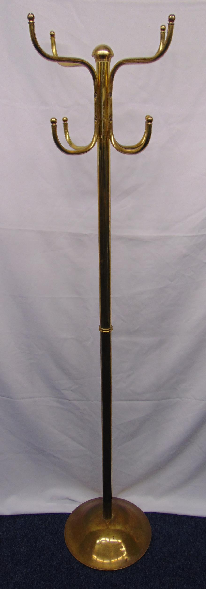 A brass hat and coat stand of tubular form on raised circular base, 176.5cm (h)