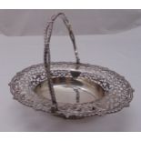 A hallmarked silver oval fruit basket with scroll pierced sides, shell and gadrooned border with