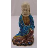 A Chinese polychromatic ceramic figurine of Lohan, 18cm (h)
