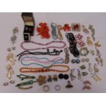 A quantity of costume jewellery to include necklaces, brooches, earrings and rings