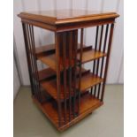 A three tier revolving mahogany Canterbury with slatted sides, 121 x 66 x 66cm A/F