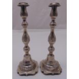 A pair of hallmarked silver table candlesticks, knopped baluster form, London 1933 approx total