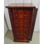 An early 19th century mahogany Wellington chest with seven drawers and turned wooden handles, by A