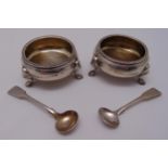 A pair of Victorian hallmarked silver salts of circular form with beaded borders on stepped hoof