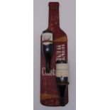Two inverted bottles of red wine on an advertising board titled Wine Constantly, 80cm (h)