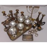 A quantity of silver plate to include candelabra, trays, napkin rings and cups