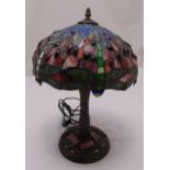 A Tiffany style desk lamp of organic form set with coloured panels and beads, 44cm (h)