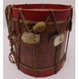 A late 19th century military drum with roped sides and a drum stick, 39.5 x 38.5cm