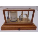 A Vintage Barograph by F. Barton and Co. Ltd of customary form in a rectangular oak and glazed case,