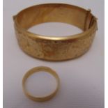 9ct gold wedding band and a 9ct gold bangle, approx total weight 33.7g