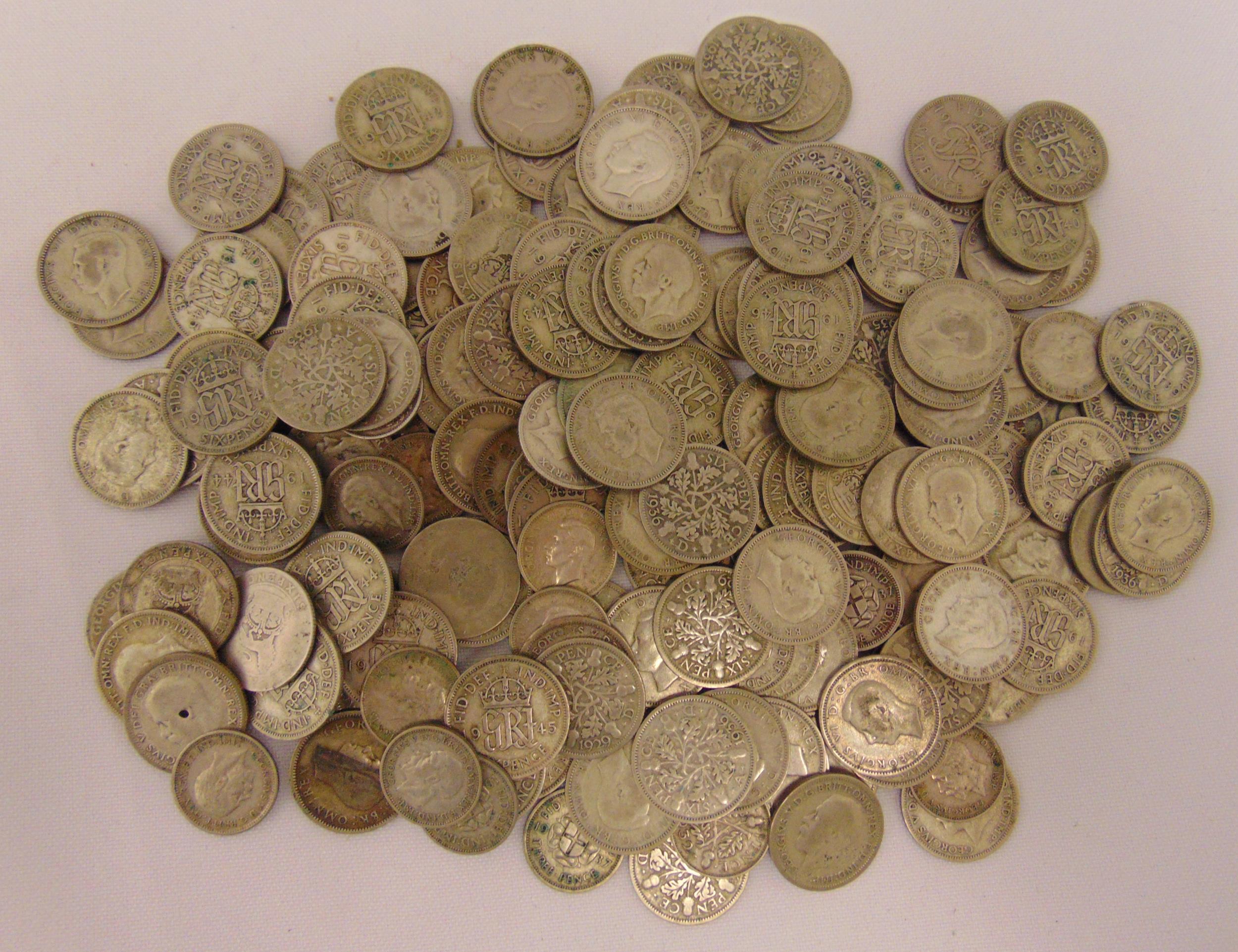 A quantity of pre 1947 GB sixpences and silver three pence, approx total weight 445g