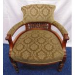 Victorian mahogany upholstered armchair on turned cylindrical legs with original castors