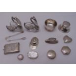 A quantity of hallmarked silver to include a vesta case, pill boxes of various shapes, a travel