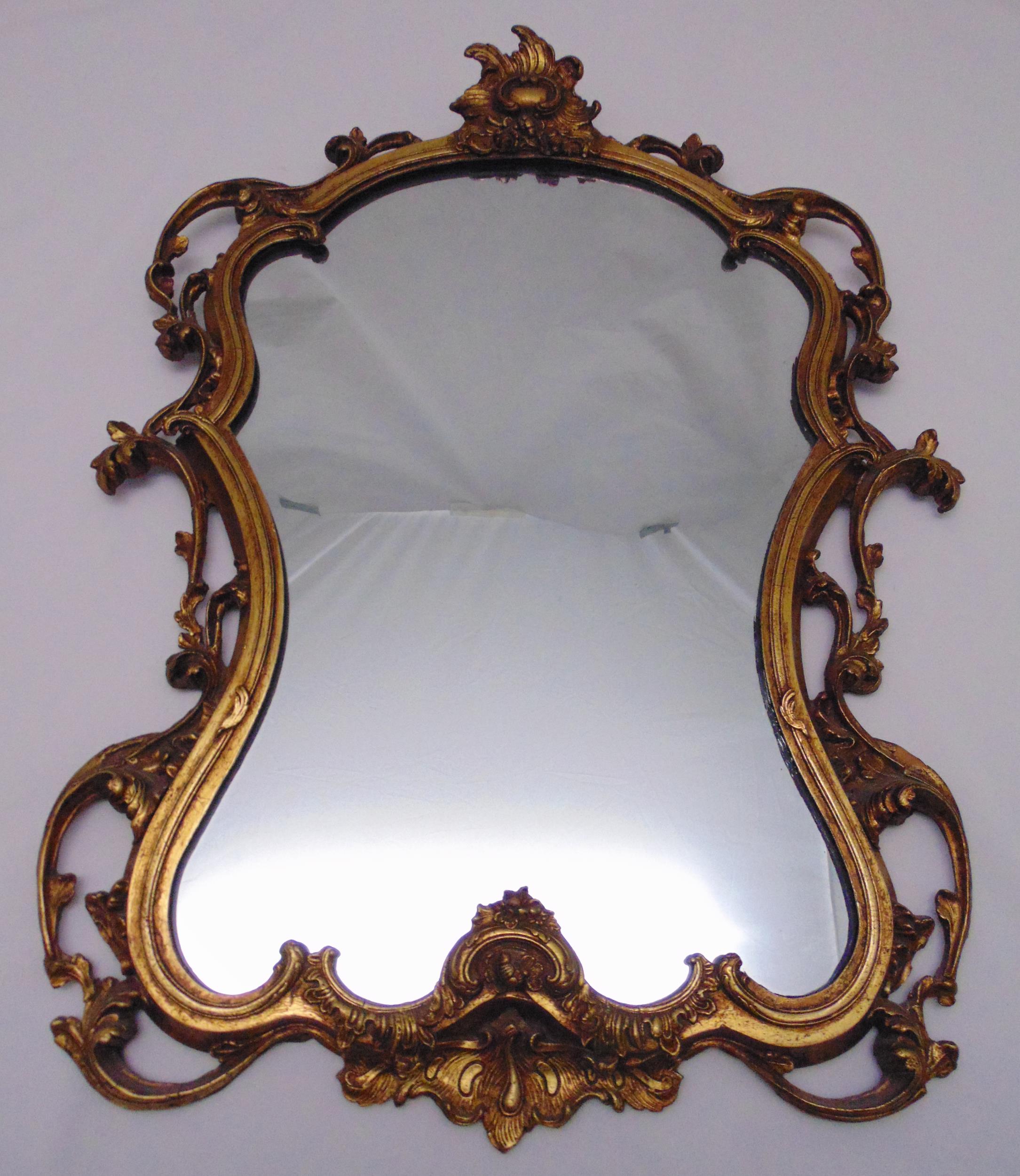 A Baroque style gilded wooden wall mirror, 77.5 x 60cm