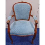 A mahogany upholstered armchair on cabriole legs