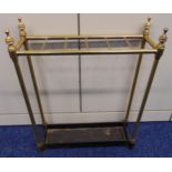 A gilt metal and cast iron rectangular umbrella and stick stand, the tubular supports with urn