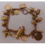 9ct gold charm bracelet with twenty five charms, approx total weight 49.1g