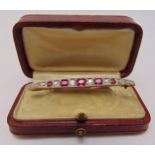 Yellow gold diamond and ruby bar brooch, approx total weight 4.2g