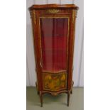 A French style glazed display cabinet with serpentine front and Vernis Martin panels on cabriole