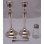 A pair of hallmarked silver table candlesticks tapering cylindrical with beaded borders,