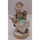 A Meissen 19th century figurine of a girl holding a dog in front of a mirror on raised circular