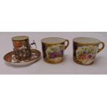 Two Coalport coffee cans and Royal Crown Derby coffee cup with hallmarked silver holder