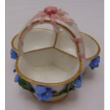 A Meissen bonbon basket, decorated with applied flowers and carrying handle, marks to the base, 8.