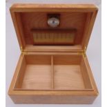 A Burr wood rectangular humidor with hinged cover, 14.5 x 34 x 23cm