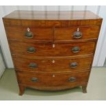 A Victorian rectangular mahogany bow fronted chest of drawers with brass swing handles on four